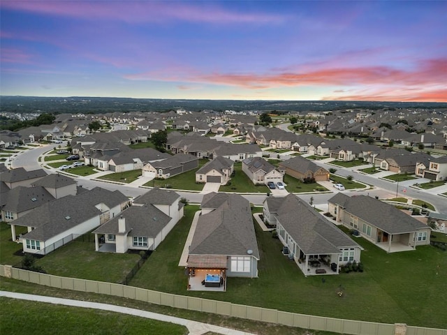 aerial view at dusk with a residential view
