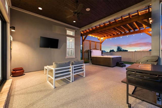 view of patio featuring a hot tub, a pergola, a ceiling fan, fence, and an outdoor hangout area