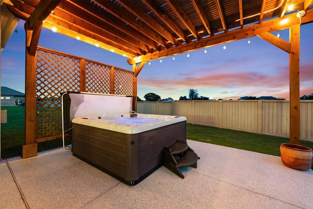 view of patio featuring a fenced backyard and a hot tub