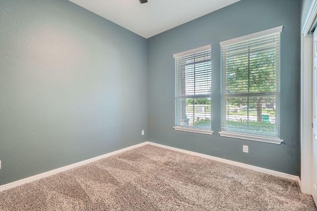 2013 Garretts Way, Manchaca, TX 78652 - carpeted empty room with healthy amount of natural light, baseboards, and ceiling fan