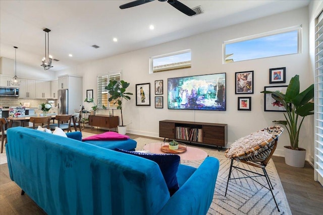 7009 Zachary Dr, Austin, TX 78724 - living area with wood finished floors, a ceiling fan, and recessed lighting