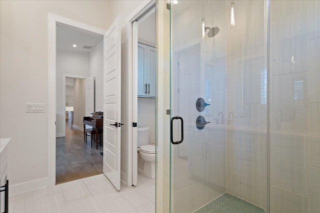 7009 Zachary Dr, Austin, TX 78724 - bathroom with a shower stall, toilet, and baseboards