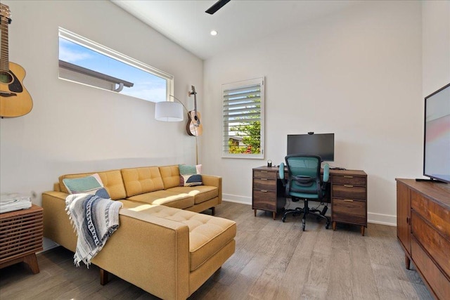 7009 Zachary Dr, Austin, TX 78724 - living room with wood finished floors, a desk, a ceiling fan, and recessed lighting