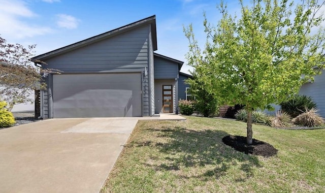7009 Zachary Dr, Austin, TX 78724 - view of front of house featuring driveway, a front lawn, and an attached garage
