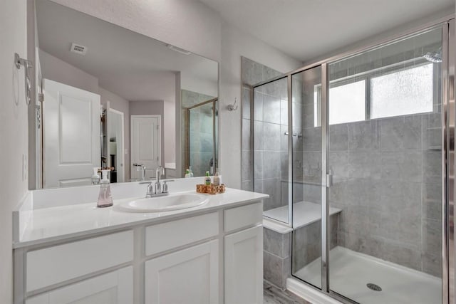 100 Vickers St, Georgetown, TX 78628 - full bath with visible vents, a shower stall, and vanity