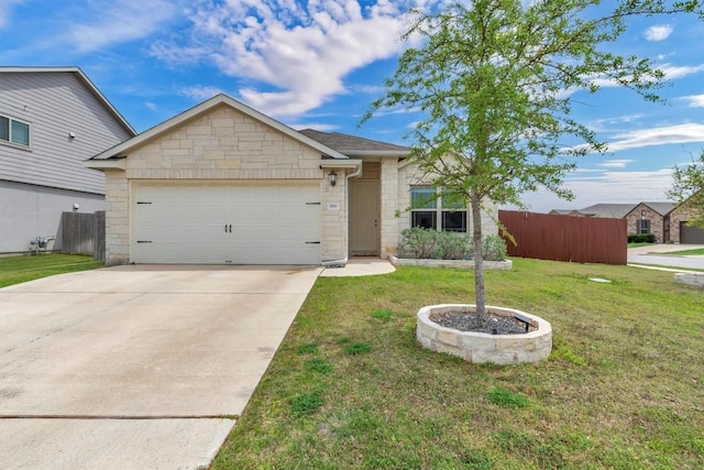 100 Vickers St, Georgetown, TX 78628 - view of front of house featuring fence, an attached garage, a front lawn, stone siding, and concrete driveway