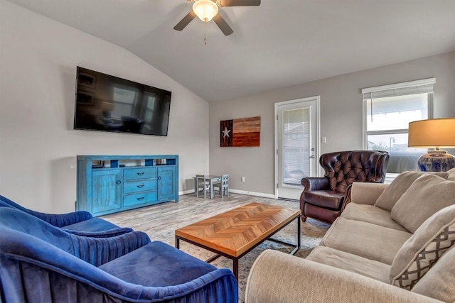100 Vickers St, Georgetown, TX 78628 - living area featuring a ceiling fan, baseboards, vaulted ceiling, and light wood-style floors