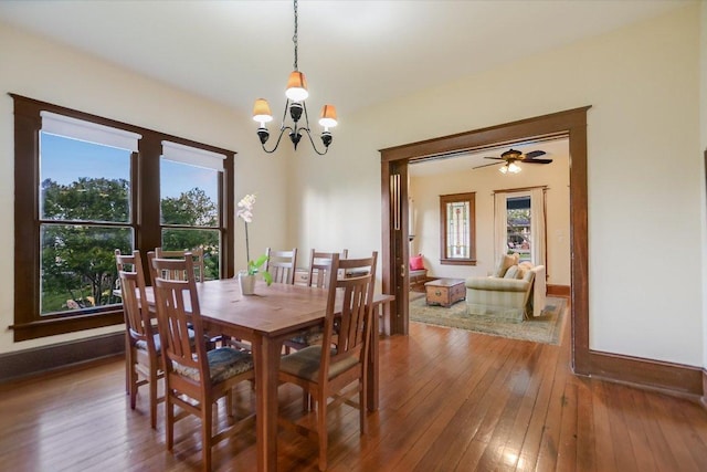 508 S Walnut St, Georgetown, TX 78626 - dining space featuring plenty of natural light, a chandelier, and wood-type flooring