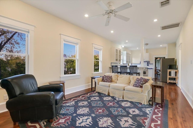 508 S Walnut St, Georgetown, TX 78626 - living room with dark wood-type flooring, ceiling fan, baseboards, and recessed lighting