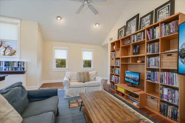 508 S Walnut St, Georgetown, TX 78626 - living room with a ceiling fan, wood finished floors, baseboards, and lofted ceiling