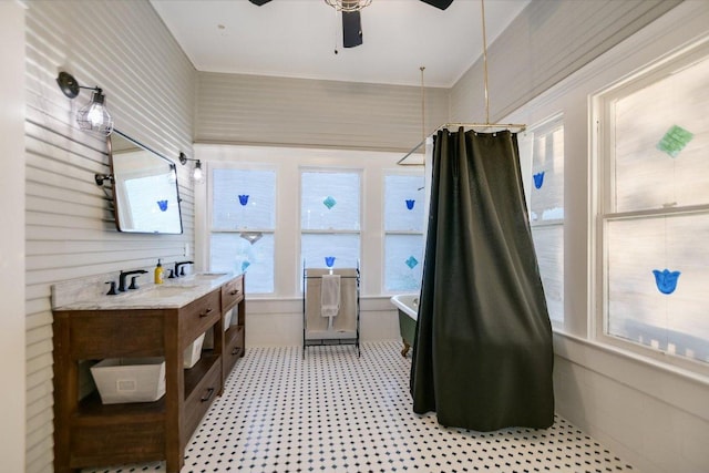508 S Walnut St, Georgetown, TX 78626 - full bath featuring a soaking tub, vanity, a ceiling fan, a shower with shower curtain, and tile patterned floors