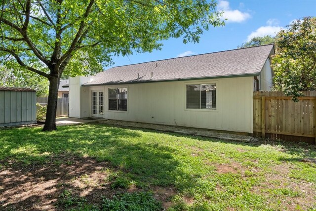 4902 Ganymede Dr, Austin, TX 78727 - rear view of house featuring french doors and roof with shingles