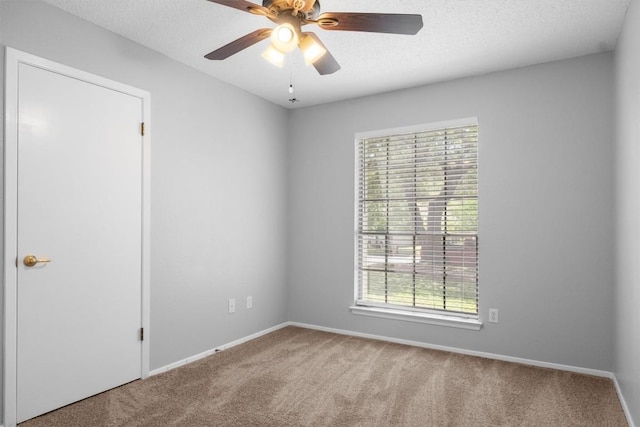 4902 Ganymede Dr, Austin, TX 78727 - carpeted empty room featuring healthy amount of natural light, a ceiling fan, baseboards, and a textured ceiling