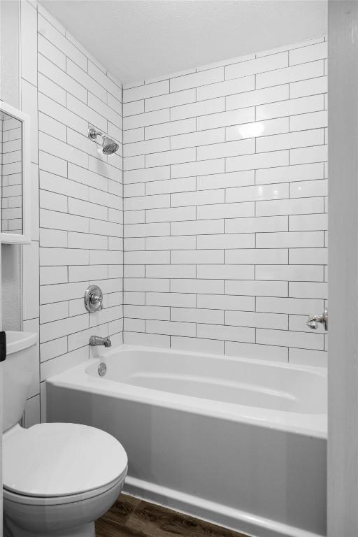 4902 Ganymede Dr, Austin, TX 78727 - bathroom with wood finished floors, toilet, and shower / bath combination