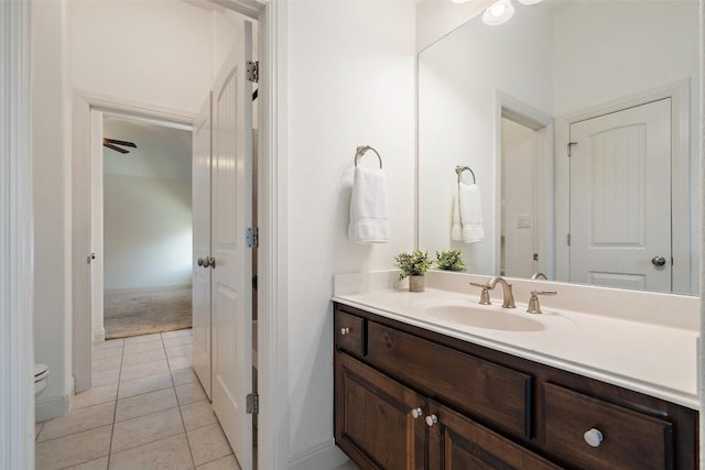 bathroom featuring tile patterned floors, toilet, and vanity