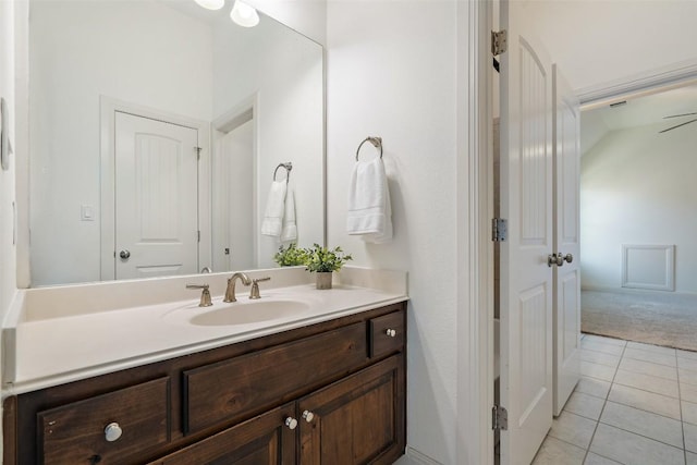 bathroom featuring tile patterned flooring and vanity