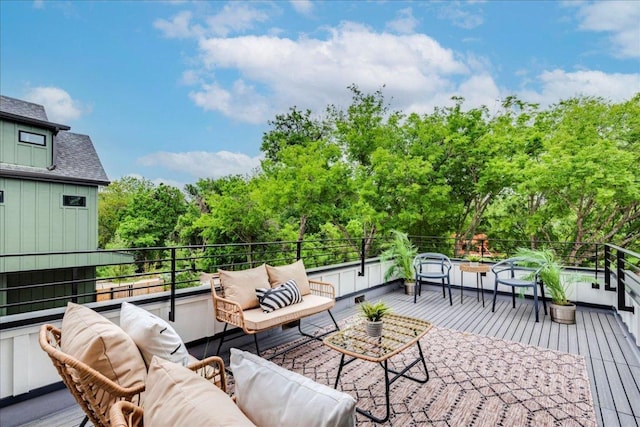 1713 E M Franklin Ave Unit 1, Austin, TX 78721 - deck with an outdoor living space and view of wooded area