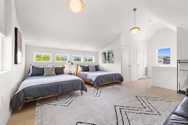 1713 E M Franklin Ave Unit 1, Austin, TX 78721 - bedroom with wood finished floors and vaulted ceiling