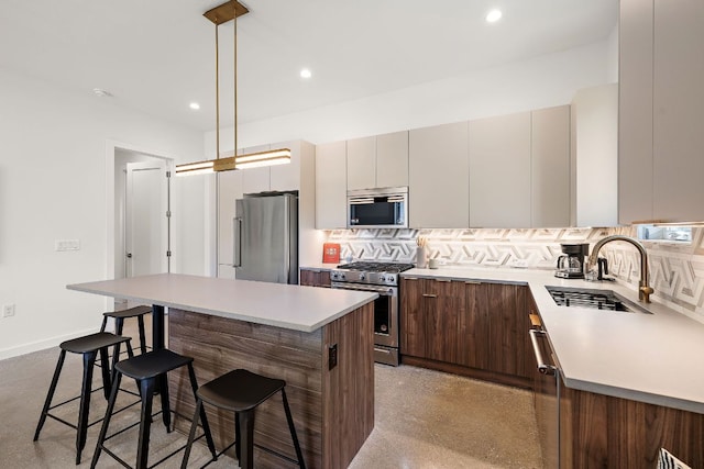 1713 E M Franklin Ave Unit 1, Austin, TX 78721 - kitchen with stainless steel appliances, tasteful backsplash, a kitchen bar, a center island, and recessed lighting
