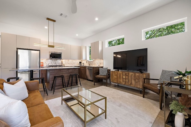 1713 E M Franklin Ave Unit 1, Austin, TX 78721 - living room featuring recessed lighting
