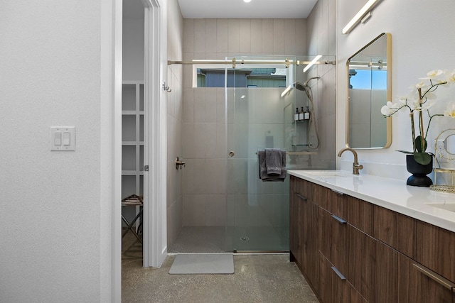 1713 E M Franklin Ave Unit 1, Austin, TX 78721 - bathroom with tiled shower, double vanity, and a spacious closet