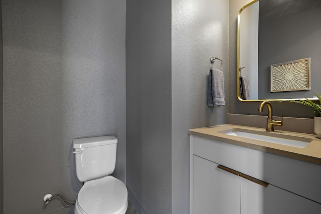 1713 E M Franklin Ave Unit 1, Austin, TX 78721 - bathroom featuring vanity and a textured wall