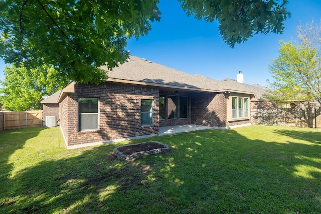 2632 Los Alamos Pass, Round Rock, TX 78665 - back of house featuring brick siding, central air condition unit, a chimney, and a patio