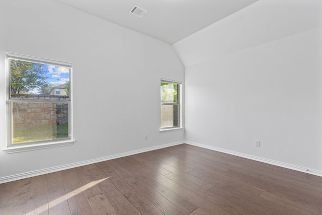 2632 Los Alamos Pass, Round Rock, TX 78665 - empty room with vaulted ceiling, dark wood-style flooring, and baseboards