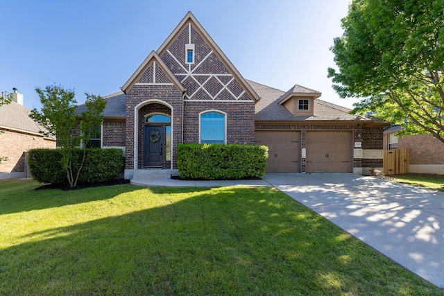 2632 Los Alamos Pass, Round Rock, TX 78665 - view of front of property featuring brick siding, an attached garage, concrete driveway, and roof with shingles