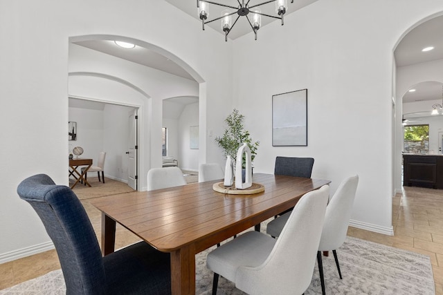 2632 Los Alamos Pass, Round Rock, TX 78665 - dining space featuring arched walkways, baseboards, and a chandelier