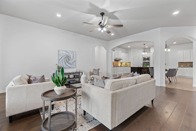 2632 Los Alamos Pass, Round Rock, TX 78665 - living room featuring arched walkways, ceiling fan, dark wood-style flooring, and recessed lighting