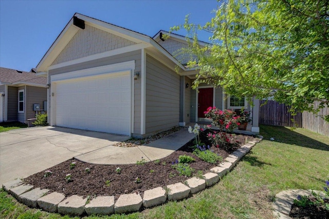 10312 Bankhead Dr, Austin, TX 78747 - view of front of house with concrete driveway and an attached garage