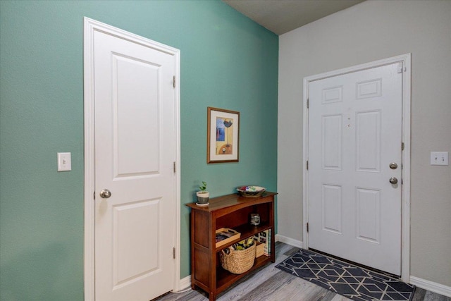 10312 Bankhead Dr, Austin, TX 78747 - foyer featuring wood finished floors and baseboards