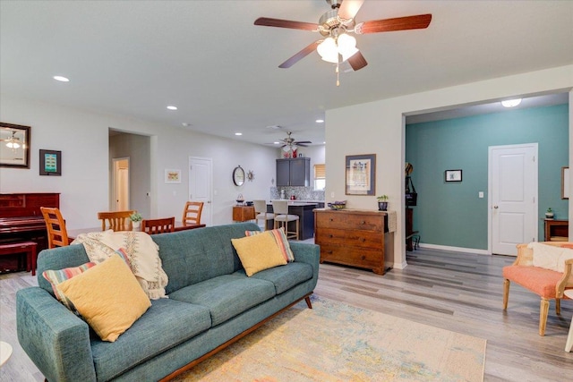 10312 Bankhead Dr, Austin, TX 78747 - living room featuring a ceiling fan, light wood finished floors, recessed lighting, and baseboards