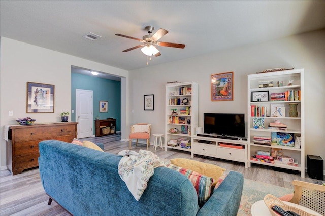 10312 Bankhead Dr, Austin, TX 78747 - living room with wood finished floors, a ceiling fan, and baseboards