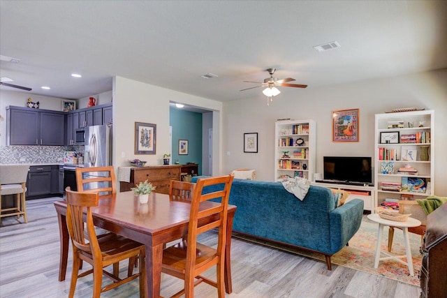 10312 Bankhead Dr, Austin, TX 78747 - dining space with a ceiling fan and light wood-style floors