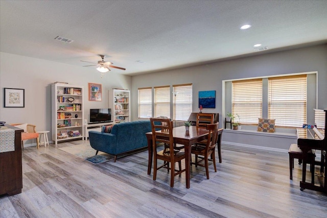 10312 Bankhead Dr, Austin, TX 78747 - dining area with wood finished floors, ceiling fan, plenty of natural light, and recessed lighting