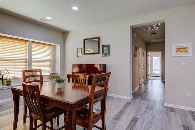 10312 Bankhead Dr, Austin, TX 78747 - dining room with plenty of natural light, light wood-type flooring, baseboards, and recessed lighting
