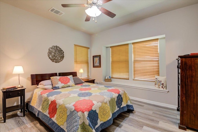10312 Bankhead Dr, Austin, TX 78747 - bedroom featuring wood finished floors, baseboards, and a ceiling fan