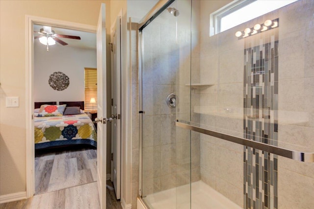 10312 Bankhead Dr, Austin, TX 78747 - full bath featuring ensuite bathroom, a stall shower, wood finished floors, and a ceiling fan