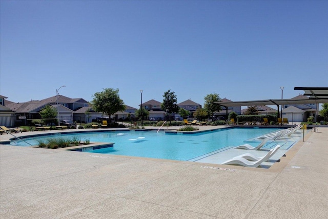 10312 Bankhead Dr, Austin, TX 78747 - community pool featuring a patio and a residential view