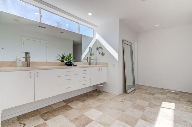 9707 Timber Ridge Pass, Austin, TX 78733 - bathroom with double vanity and recessed lighting