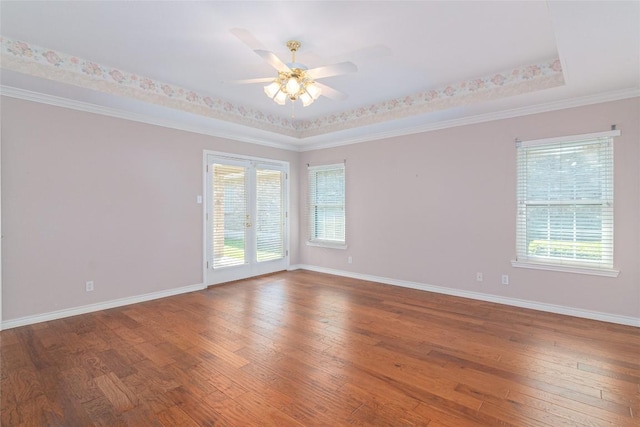 668 Sagewood Pkwy, Seguin, TX 78155 - spare room with wood-type flooring, healthy amount of natural light, a ceiling fan, and ornamental molding