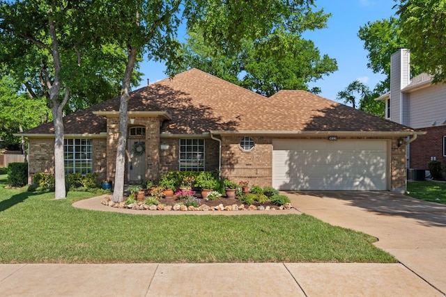 view of front of house with a shingled roof, a garage, concrete driveway, brick siding, and a front lawn