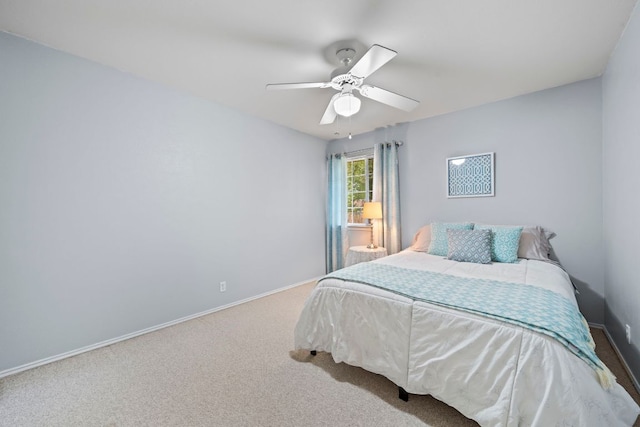 bedroom with carpet floors, baseboards, and ceiling fan