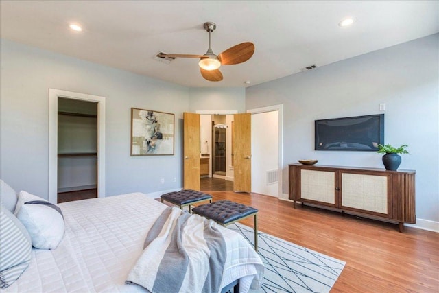 2608 E 6th St Unit 6, Austin, TX 78702 - bedroom with baseboards, wood finished floors, visible vents, and recessed lighting