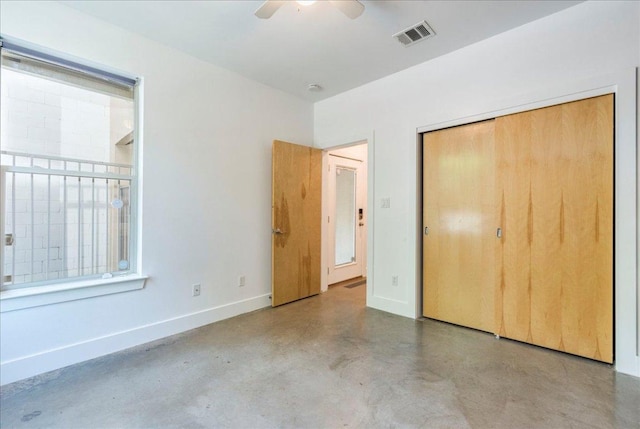 2608 E 6th St Unit 6, Austin, TX 78702 - unfurnished bedroom with a ceiling fan, a closet, finished concrete flooring, baseboards, and visible vents