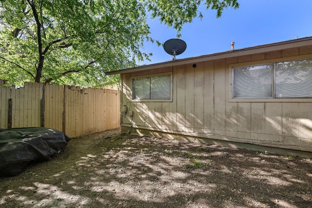 view of side of property with fence