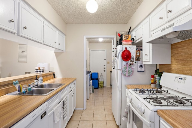 kitchen featuring light countertops, white cabinets, white appliances, and under cabinet range hood