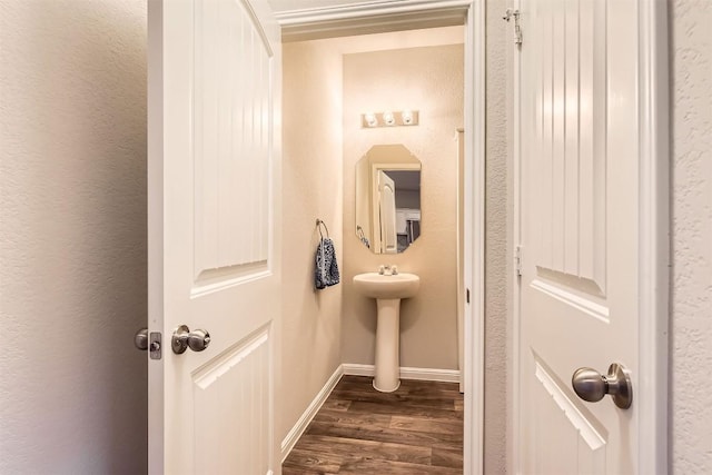 2232 Baugh Rd, Austin, TX 78754 - bathroom featuring wood finished floors, baseboards, and a sink